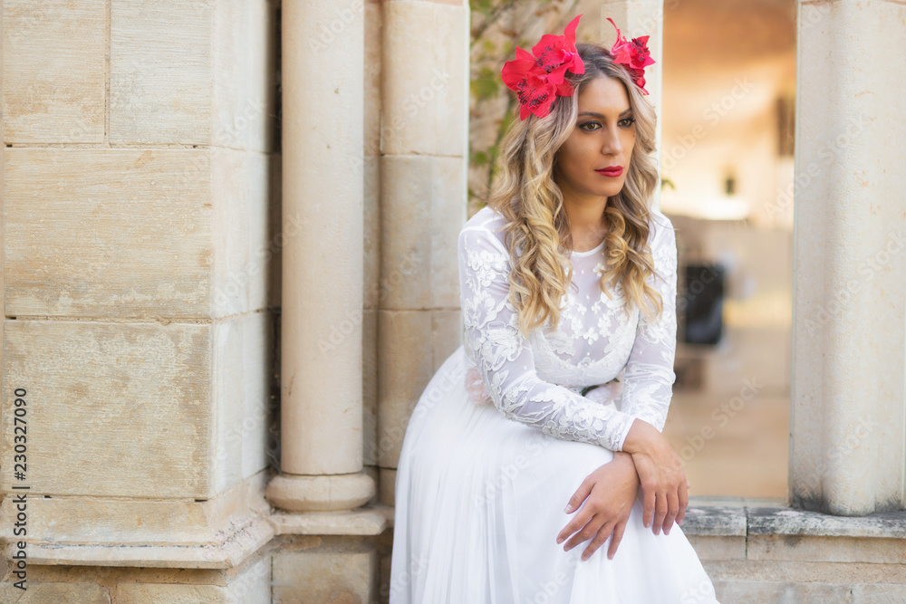 Portrait of beautiful blond girl in medieval dress with red diadem. Fairy tale scene