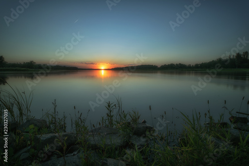 A wonderful sunset on the banks of the river Oder. Concept: vacation and travel