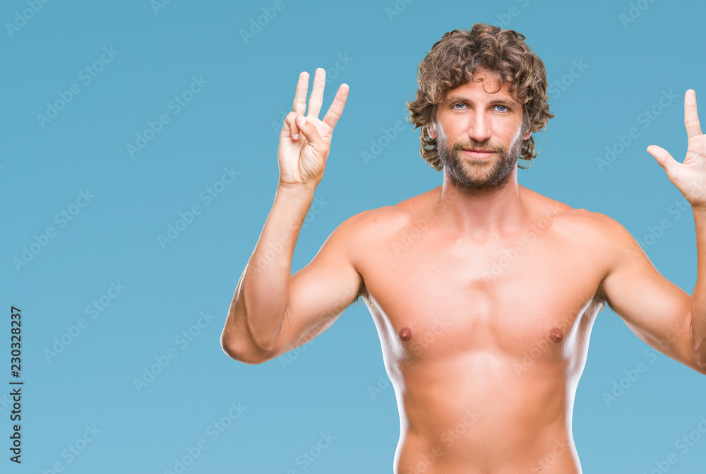 Handsome hispanic model man sexy and shirtless over isolated background showing and pointing up with fingers number eight while smiling confident and happy. Handsome hispanic model man sexy and shirtless over isolated background showing and pointing up with fingers number eight while smiling confident and happy.