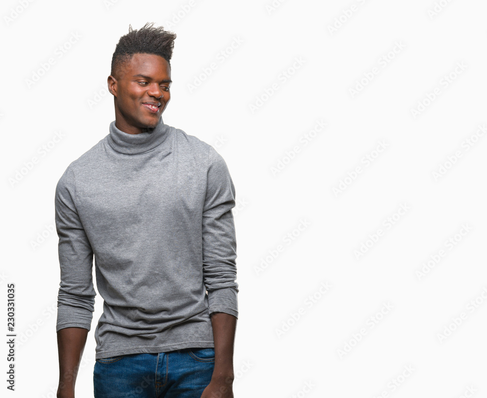 Young african american man over isolated background looking away to side with smile on face, natural expression. Laughing confident. Young african american man over isolated background looking away to side with smile on face, natural expression. Laughing confident.