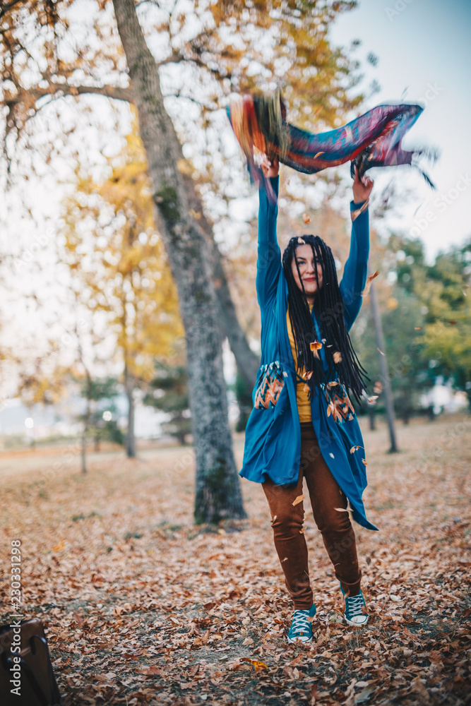 Portrait of young woman in autumn park Portrait of young woman in autumn park