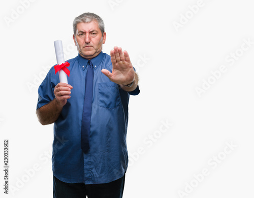 Handsome senior man holding degree over isolated background with open hand doing stop sign with serious and confident expression, defense gesture
