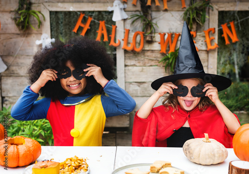 Kids in costume enjoying the Halloween season photo