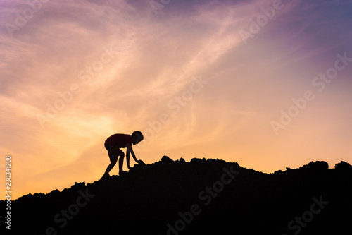 silhouette of children on top of mountain