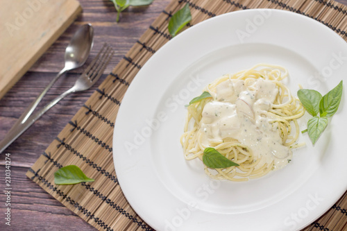 White Sauce Spaghetti a white dish on a wooden table