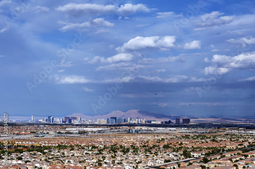 Photography Aerial view of residential neighborhood in notheast Las Vegas and Las Vegas Strip on mountain background