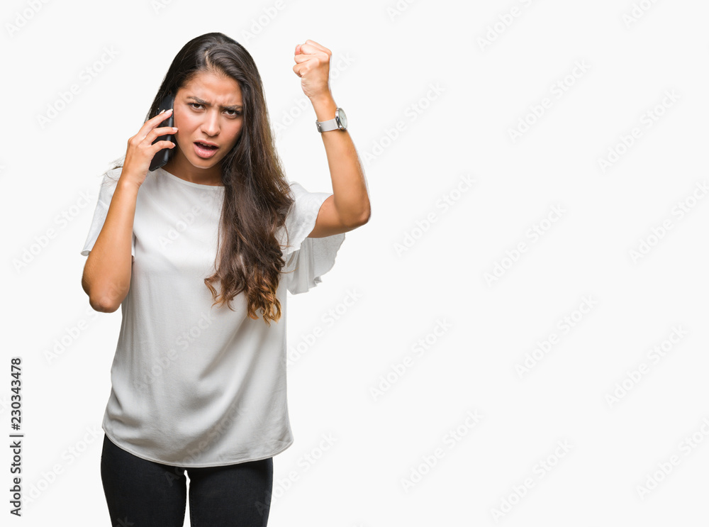 Young beautiful arab woman talking on the phone over isolated background annoyed and frustrated shouting with anger, crazy and yelling with raised hand, anger concept Young beautiful arab woman talking on the phone over isolated background annoyed and frustrated shouting with anger, crazy and yelling with raised hand, anger concept