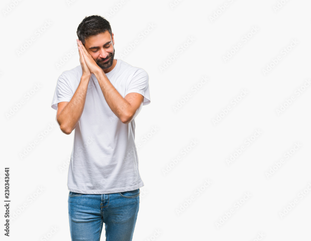 Adult hispanic man over isolated background sleeping tired dreaming and posing with hands together while smiling with closed eyes. Adult hispanic man over isolated background sleeping tired dreaming and posing with hands together while smiling with closed eyes.