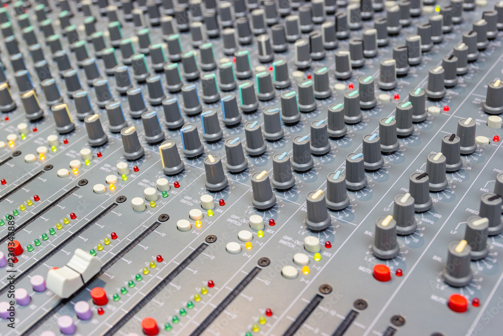 Fototapeta premium Close up Mixing Console of a big HiFi system, The audio equipment and control panel of digital studio mixer