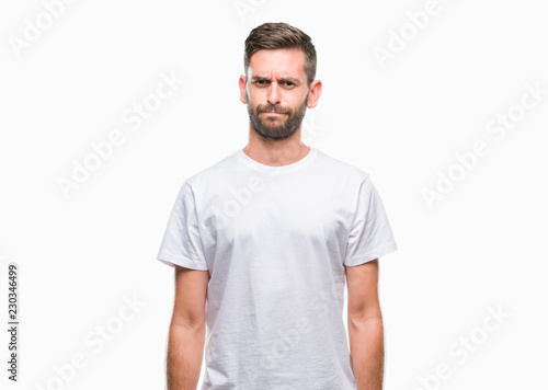 Canvas Print Young handsome man over isolated background skeptic and nervous, frowning upset because of problem