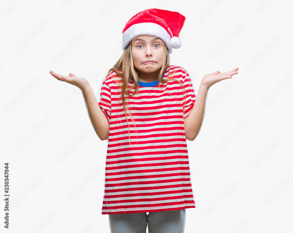 Young beautiful girl wearing christmas hat over isolated background clueless and confused expression with arms and hands raised. Doubt concept. Young beautiful girl wearing christmas hat over isolated background clueless and confused expression with arms and hands raised. Doubt concept.