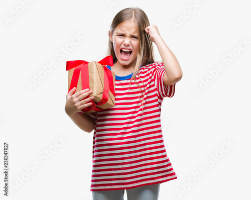 Young beautiful girl giving christmas or valentine gift over isolated background annoyed and frustrated shouting with anger  crazy and yelling with raised hand  anger concept