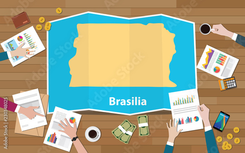 brasilia brazil capital city region economy growth with team discuss on fold maps view from top