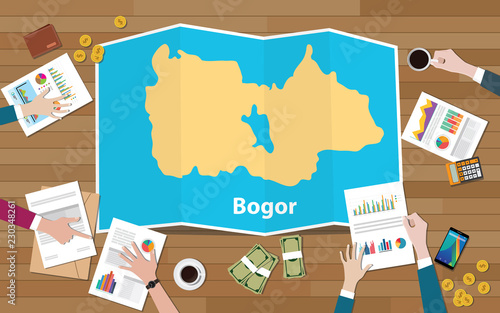 bogor indonesia java city region economy growth with team discuss on fold maps view from top