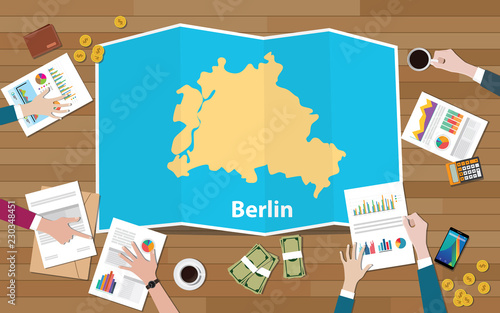 berlin german germany city region economy growth with team discuss on fold maps view from top