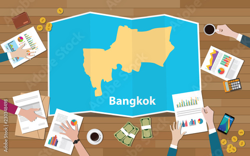 bangkok thailand capital city region economy growth with team discuss on fold maps view from top