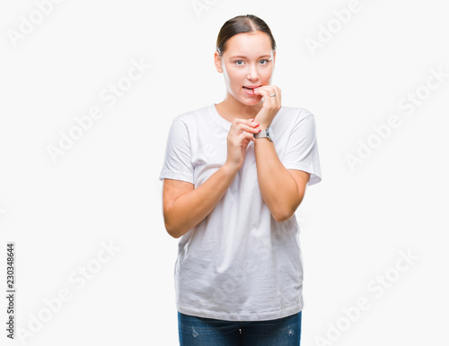 Young beautiful caucasian woman over isolated background looking stressed and nervous with hands on mouth biting nails. Anxiety problem.