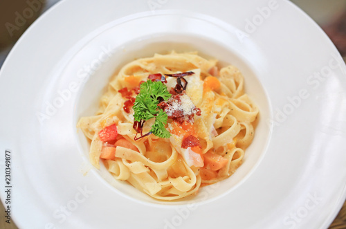 Close-up spaghetti Carbonara on white bowl.