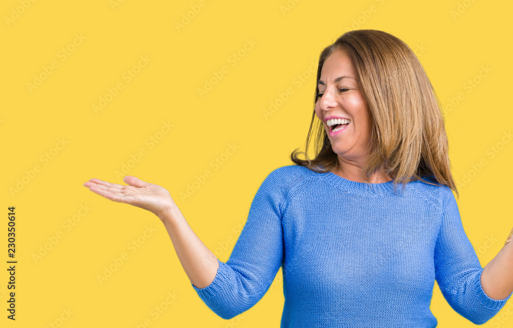 Middle age beautiful woman wearing winter sweater over isolated background Smiling showing both hands open palms, presenting and advertising comparison and balance Middle age beautiful woman wearing winter sweater over isolated background Smiling showing both hands open palms, presenting and advertising comparison and balance