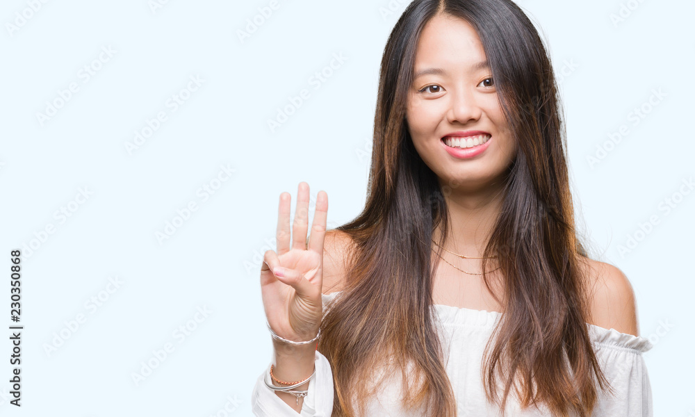 Young asian woman over isolated background showing and pointing up with fingers number three while smiling confident and happy. Young asian woman over isolated background showing and pointing up with fingers number three while smiling confident and happy.