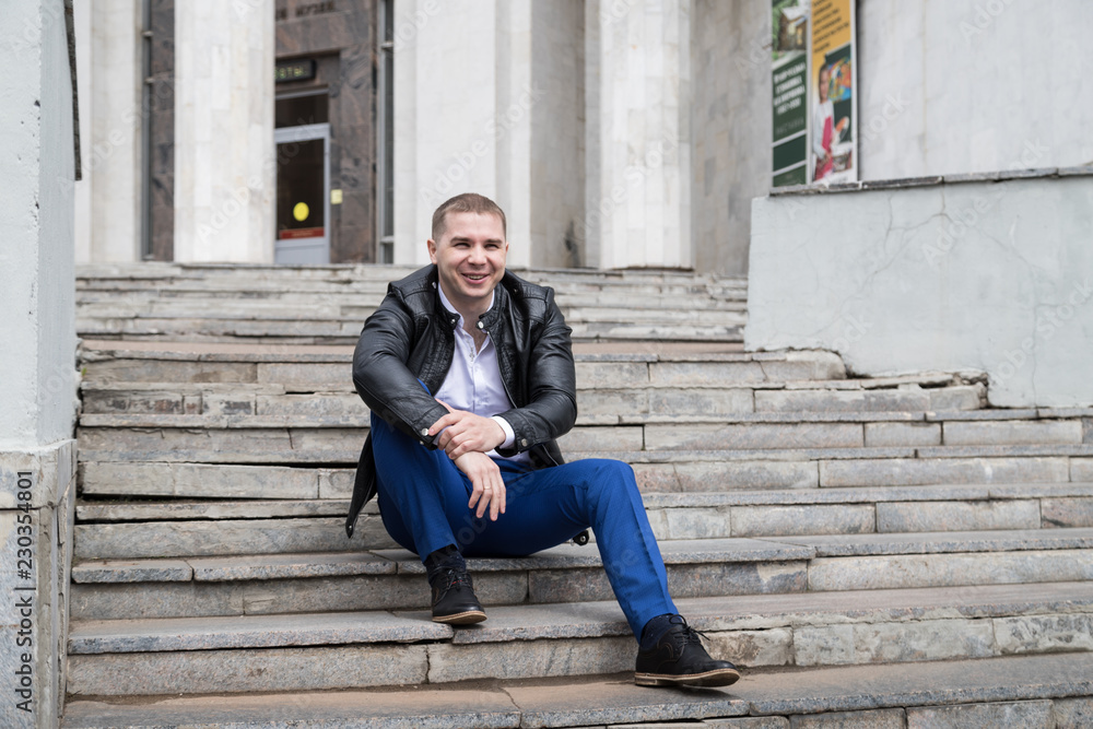 Portrait of handsome young man on the steps Portrait of handsome young man on the steps