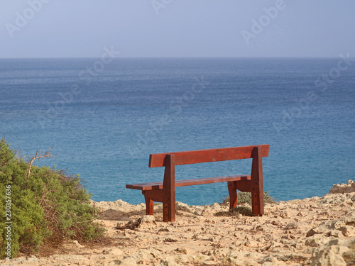 single bench in the park Cavo Greco in Ayia Napa  cyprus overlooking the mediterranean Sea