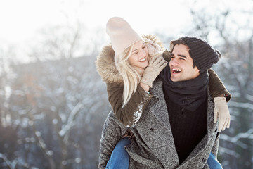 Two young people enjoying in the snow