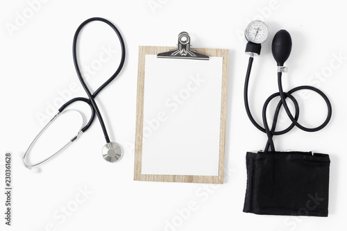 Fotografie Workplace doctor sphygmomanometer white background top view