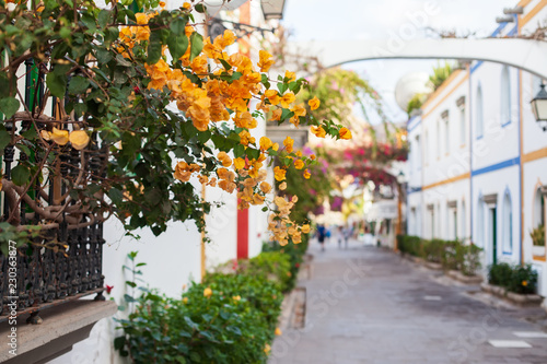 Picturesque spanish street with flowers in Gran Canaria island