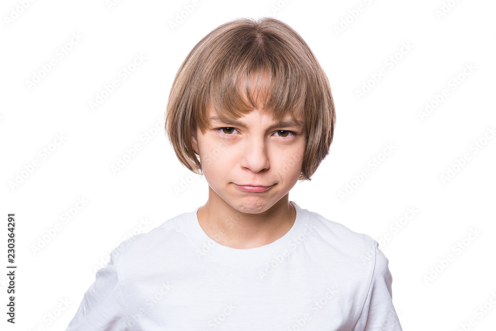 Sad attractive caucasian girl, isolated on white background. Unhappy schoolgirl looking at camera. Child in white t-shirt - emotional portrait close-up. Sad attractive caucasian girl, isolated on white background. Unhappy schoolgirl looking at camera. Child in white t-shirt - emotional portrait close-up.