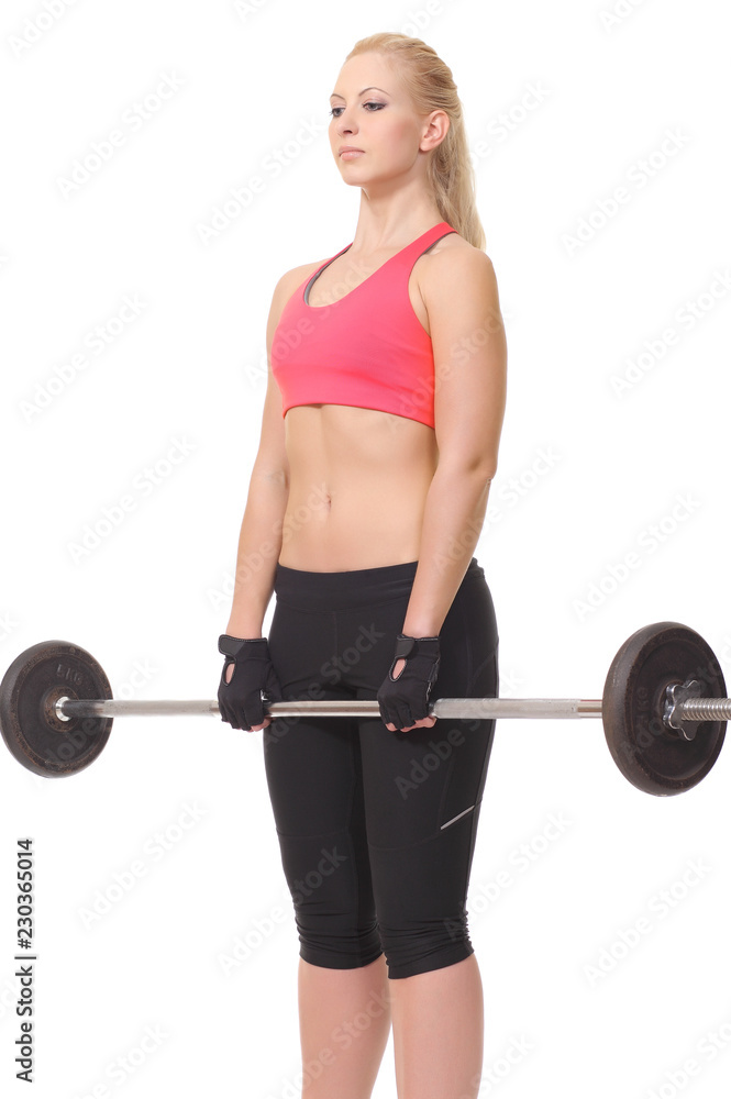 Obraz premium young fitness girl trains in the gym