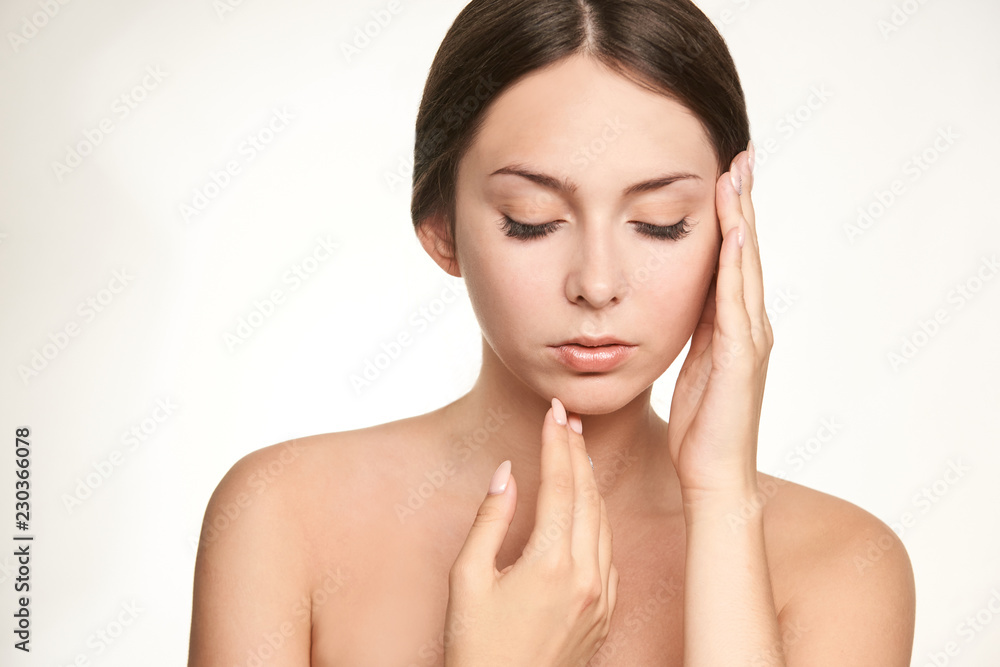 Young girl face lift lotion. Plastic face. Massage therapy. Beauty woman skin cream Young girl face lift lotion. Plastic face. Massage therapy. Beauty woman skin cream