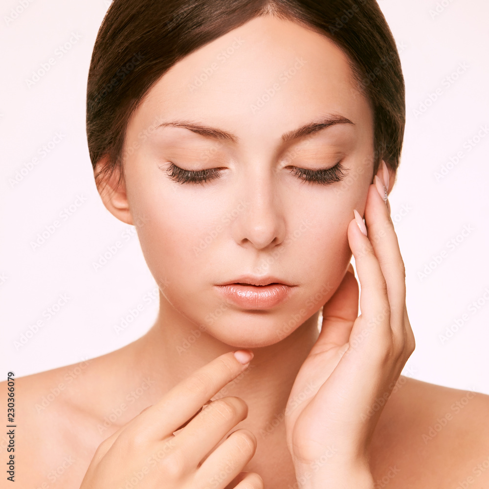 Young girl face lift lotion. Plastic face. Massage therapy. Beauty woman skin cream Young girl face lift lotion. Plastic face. Massage therapy. Beauty woman skin cream