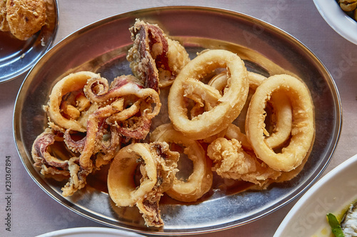 fried calamary rings, grilled squid with lemon traditional Greek and Cypriot cuisine