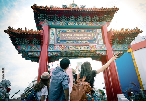 Photography Traveler are arriving at the front of china town gateway in Thailand
