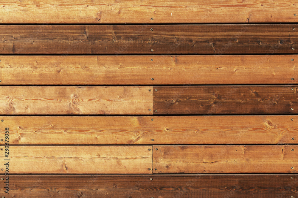 Dark wood texture background. Background of natural texture of old cracked dark wood for design. Wooden boards with a shield Dark wood texture background. Background of natural texture of old cracked dark wood for design. Wooden boards with a shield