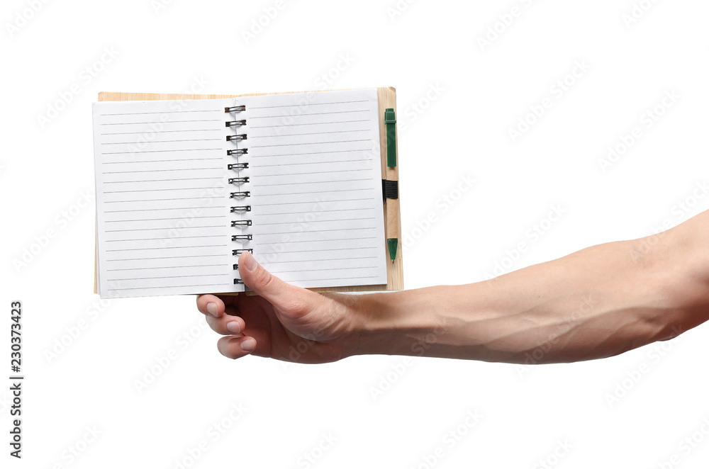 Blank page notepad with copy space and pen in the businessman hands isolated on white background. Blank page notepad with copy space and pen in the businessman hands isolated on white background.