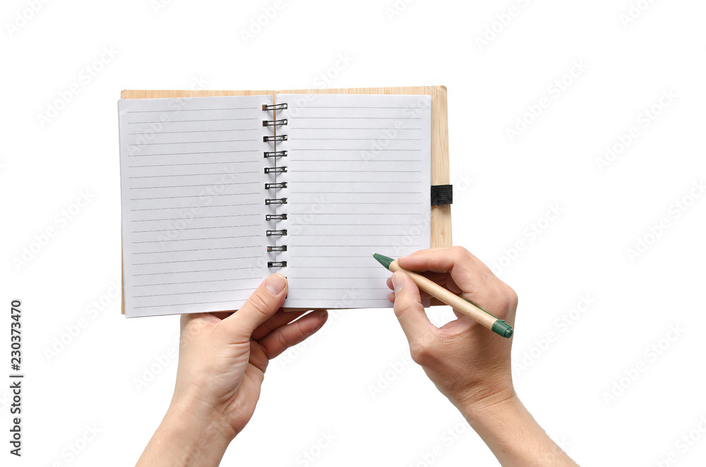 Blank page notepad with copy space and pen in the businessman hands isolated on white background. Blank page notepad with copy space and pen in the businessman hands isolated on white background.