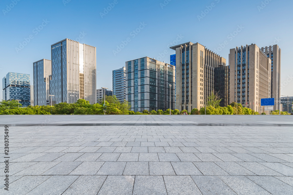 Panoramic skyline and modern business office buildings with empty road,empty concrete square floor