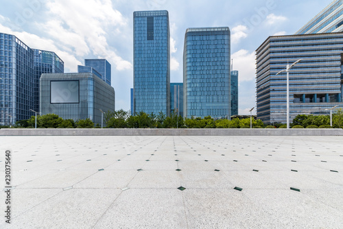 Panoramic skyline and modern business office buildings with empty road empty concrete square floor