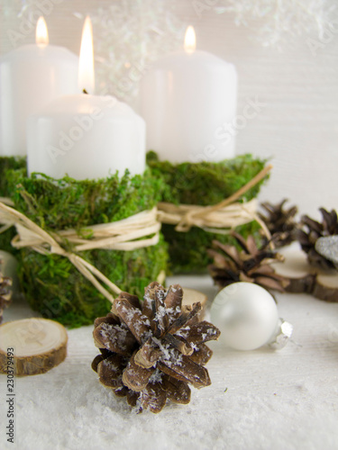 Christmas composition in the Scandinavian style. Candles, natural elements, rustic style.