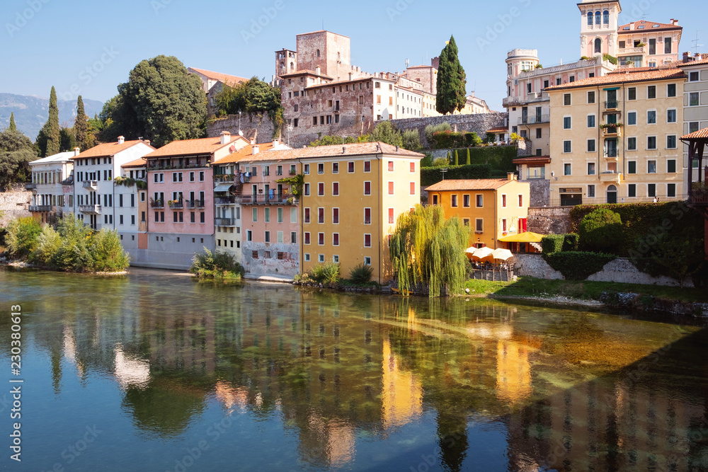 Bassano del Grappa (Italy, Veneto Region): houses over Brenta river shores. Color image