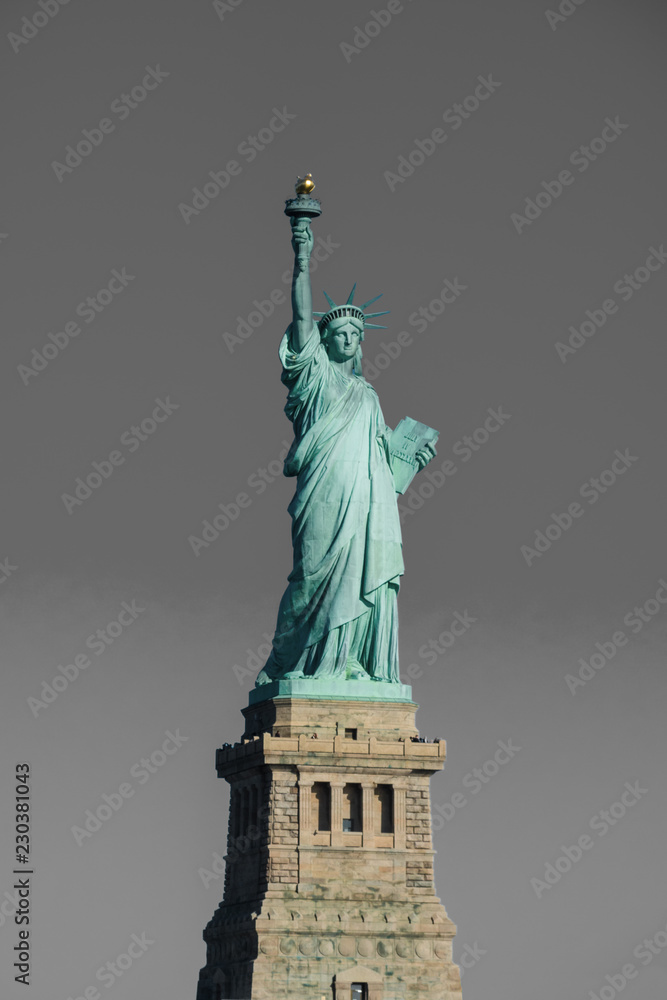 Statue of Liberty at perfect weather conditions blue sky copper Statue of Liberty at perfect weather conditions blue sky copper