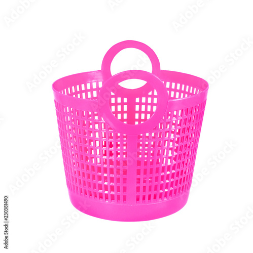 Small pink plastic basket isolated on whitee photo