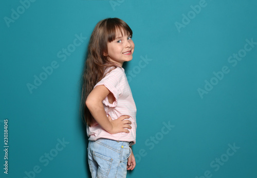 Little girl in t-shirt on c...