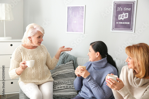 Three mature women enjoying...