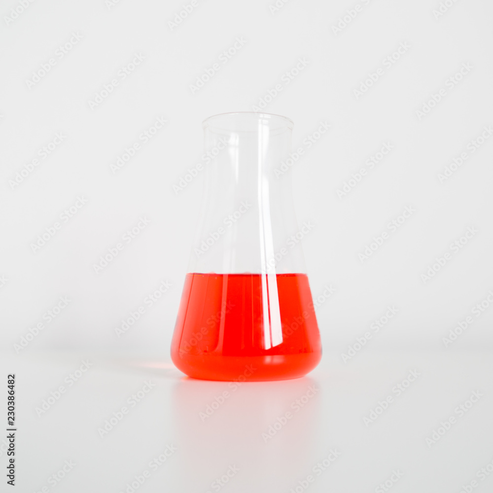 Erlenmeyer flask on white laboratory table Erlenmeyer flask on white laboratory table