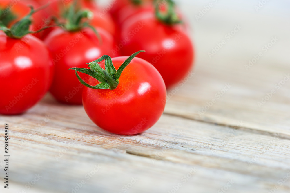 Fresh tomatoes on old wooden table Fresh tomatoes on old wooden table