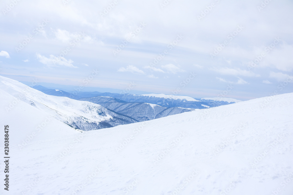Ukrainian Carpathian mountains in winter. Dragobrat View from the top. Snow drops Winter fairy tale. Traveling