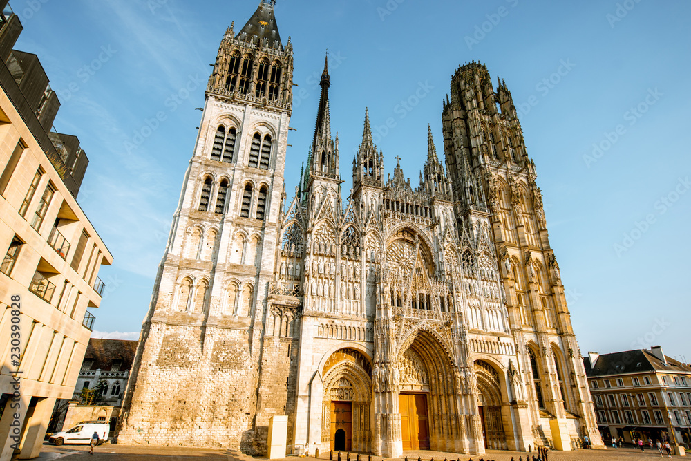 View from below on the facade of the famous Rouen gothic cathedral in Rouen city, the capital of Normandy region in France - obrazy, fototapety, plakaty 